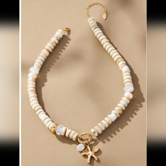 Anthropologie Jewelry - Anthropologie Cream and Gold Necklace with Starfish Charm